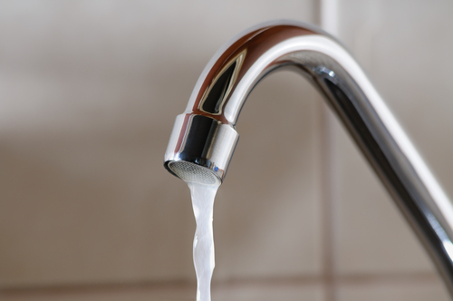 A faucet with running water