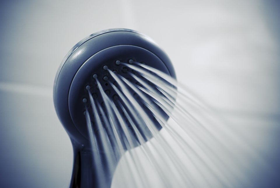 A shower head streaming water