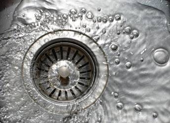 Water swirling down a drain