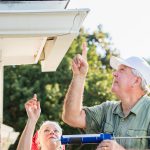 Senior couple doing home maintenance